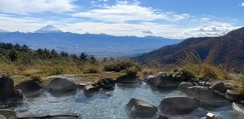 Scenic view onsen overlooking Mt Fuji or surrounding valleys